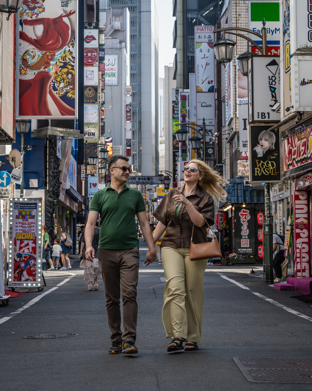 Couple walking through the streets of Shinjuku, Tokyo